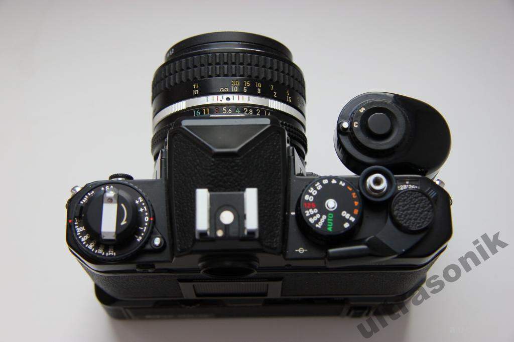 Пленочный фотоаппарат Nikon FE + Nikkor 50mm/1.4 Ф52mm + бустер MD-12 Japan Вживане - фото фото фото 1