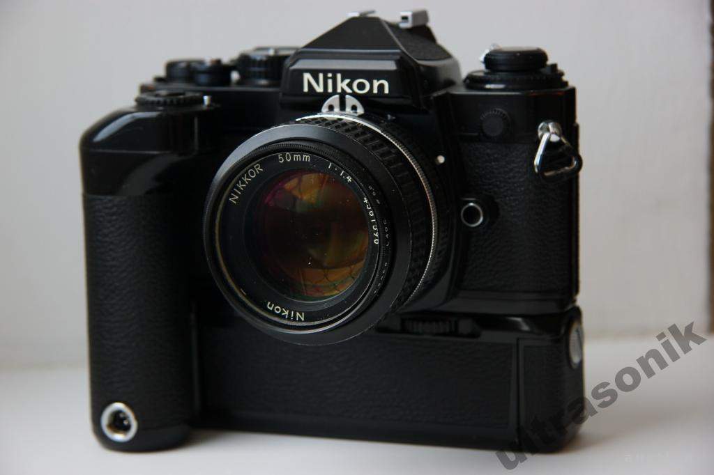 Пленочный фотоаппарат Nikon FE + Nikkor 50mm/1.4 Ф52mm + бустер MD-12 Japan Вживане - фото фото фото 3