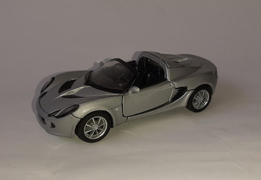 Модель Lotus Elise 111s, 2003г. Welly, номерная модель, масштаб 1:43. - фото фото фото 0