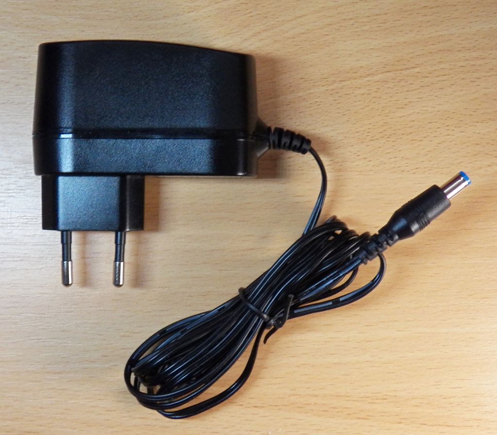 Адаптер живлення 12V 1A 12W AC/DC Новий 5,5*2,1mm Німеччина - фото фото фото 0