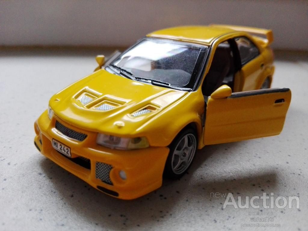 1/43 MITSUBISHI LANCER. CARARAMA. - фото фото фото 0