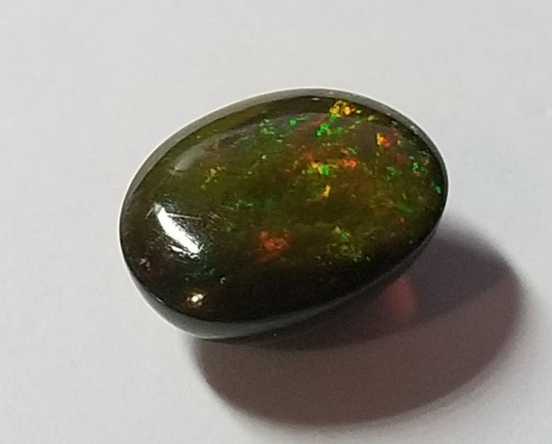 Кабошон опал 2.34 Ct     10 x 8 mm - фото фото фото 8