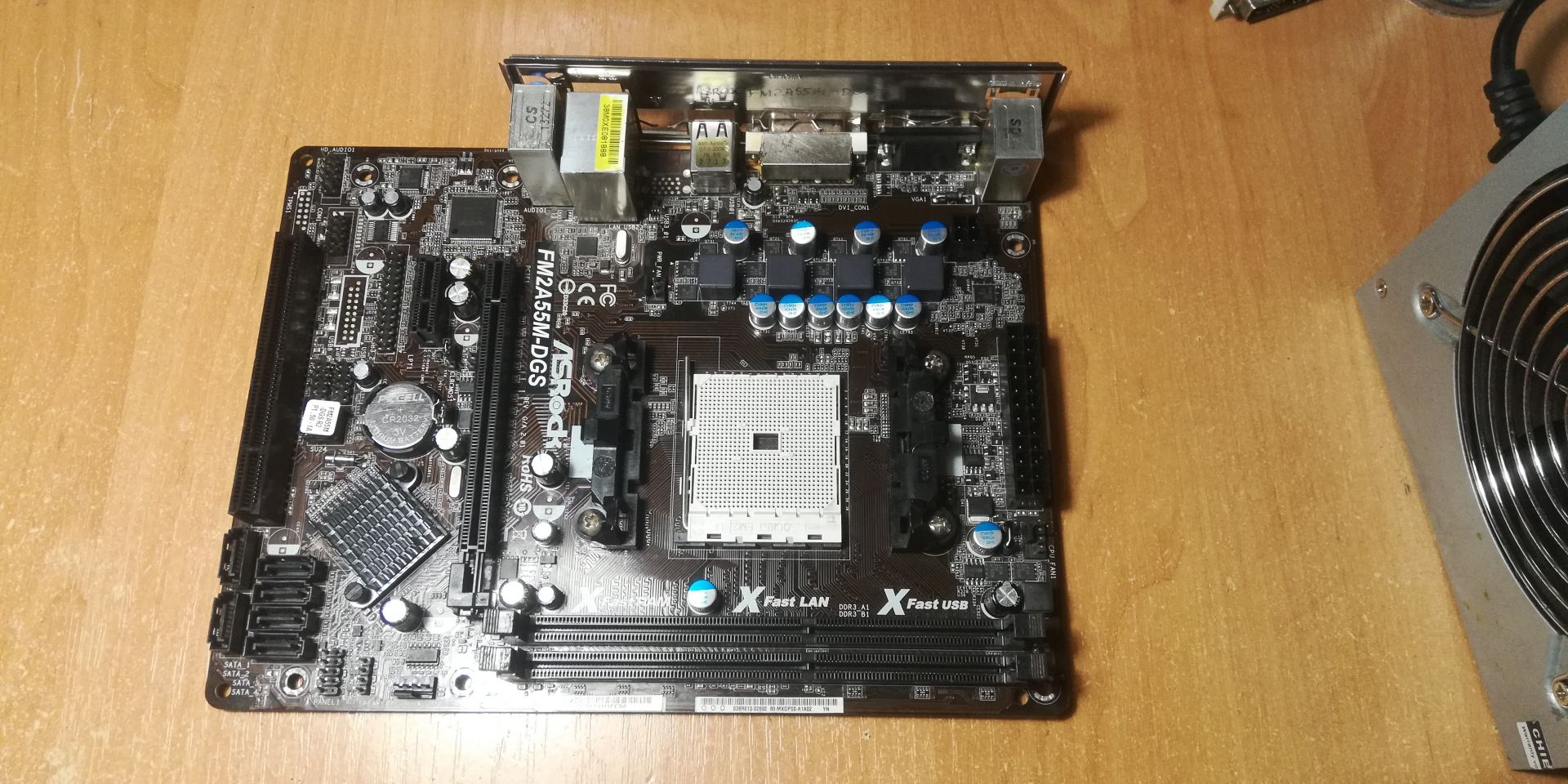 Материнская плата ASRock FM2A55M-DGS R2.0      (sFM2, AMD A55, PCI-Ex16) - фото фото фото 0