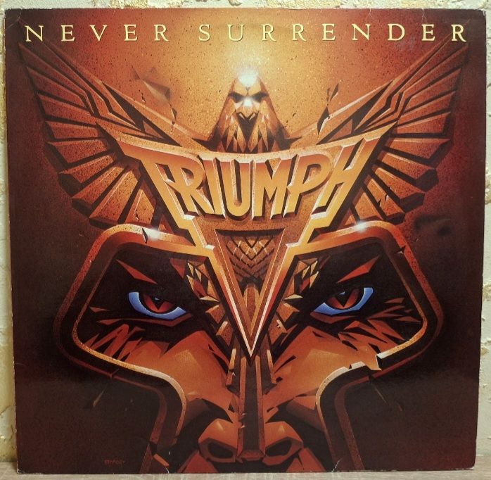 Triumph - Never Surrender - 1983.  (LP). 12. Vinyl. Пластинка. Germany. - фото фото фото 0