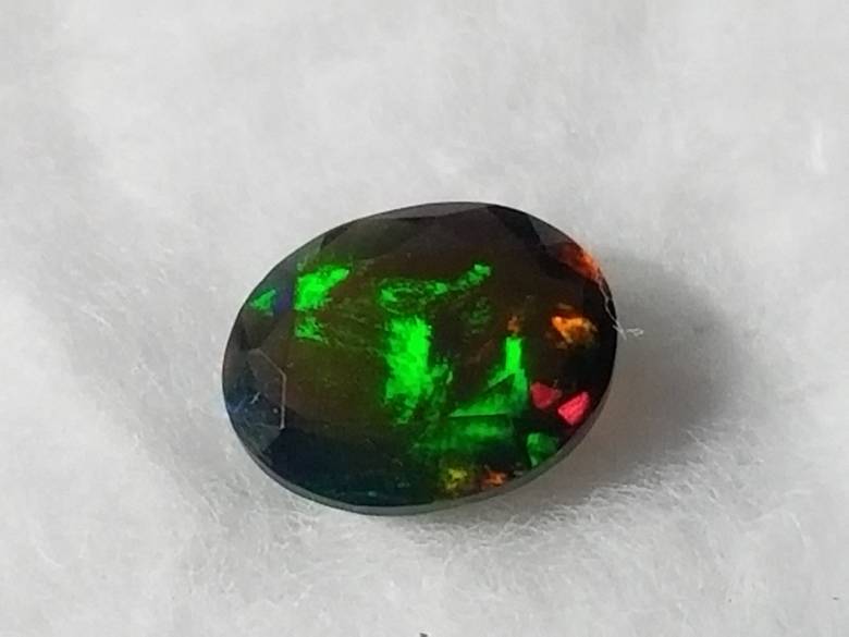 Черный опал 1.42 Ct   9.60 x 7.64 x 4.88 MM - фото фото фото 1
