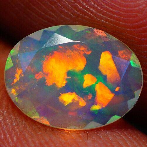 Эфиопский опал 1.22 Ct    10.29 X 7.00 X 4.39 MM - фото фото фото 0
