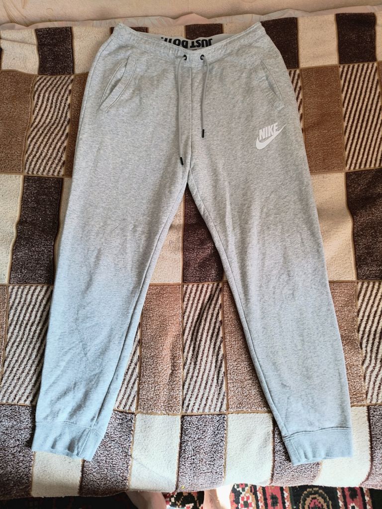 Штани спортивні Nike Rally Fleece Joggers - фото фото фото 0
