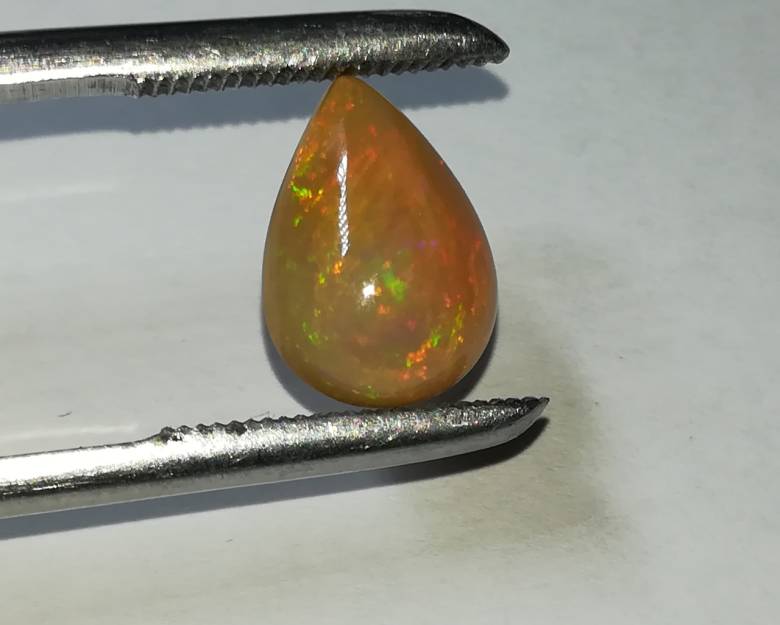 Эфиопский опал кабошон  2.50Ct  12.77 x 9.36 x 5.12 mm - фото фото фото 1