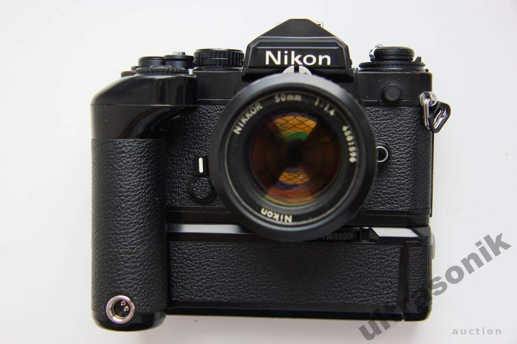 Пленочный фотоаппарат Nikon FE + Nikkor 50mm/1.4 Ф52mm + бустер MD-12 Japan Вживане - фото фото фото 0