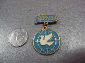Пам'ятні і ювілейні Памятные и юбилейные ^/--/^ знак 1986 год мира подвесной №10503 ^_^^^ 1986 рік світу підвісний No /--/ 10503 - фото фото фото
