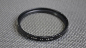 Світлофільтри Светофильтры ^/--/^ Tokina UV 49 /--/ mm. защитный ультрафиолетовый светофильтр 100% оригинал Japan Вживане ^_^^^ Tokina UV 49 /--/ mm. захисний ультрафіолетовий світлофільтр 100% оригінал Japan - фото фото фото