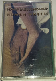 Касети Кассеты ^/--/^ JOHN COUGAR MELLENCAMP Human Wheels.  Cassette    (US) ^_^^^ JOHN COUGAR MELLENCAMP Human Wheels. Cassette (US) - фото фото фото