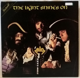 Платівки Пластинки ^/--/^ Electric Light Orchestra / ELO - The Light Shines On - 1971-79.    (LP). 12. Vinyl. Пластинка. England ^_^^^ Electric Light Orchestra / ELO - The Light Shines On - 1971-79. 12. Vinyl. Платівка. England - фото фото фото