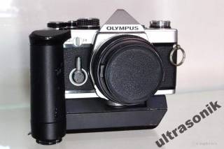 Вінтажні фотоапарати Винтажные фотоаппараты ^/--/^ Пленочный фотоаппарат Olympus OM-2 /--/ n + Zuiko 50 /--/ mm f /--/ 1.8 + бустер Winder 2 Вживане ^_^^^ Плівковий фотоапарат Olympus OM-2 /--/ n + Zuiko 50 /--/ mm f /--/ 1.8 + бустер Winder 2 - фото фото фото