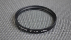 Світлофільтри Светофильтры ^/--/^ Spiraton Opticap UV 49 /--/ mm. защитный ультрафиолетовый светофильтр 100% оригинал Japan Вживане ^_^^^ Spiraton Opticap UV 49 /--/ mm. захисний ультрафіолетовий світлофільтр 100% оригінал Japan - фото фото фото