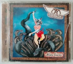 Музичні диски Музыкальные диски ^/--/^ CD Aerosmith – Nine Lives    (1997, Sony Rec SRCS 8263, Matrix IFPI 45 /--/ F /--/ 3 CPDP-000980 1, Japan) ^_^^^ CD Aerosmith – Nine Lives (1997, Sony Rec SRCS 8263, Matrix IFPI 45 /--/ F /--/ 3 CPDP-000980 1, Japan) - фото фото фото