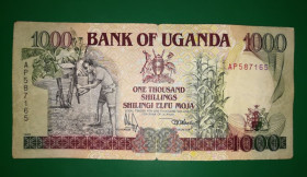 Уганда Уганда ^/--/^ UGANDA Уганда 1000 шилінгів 1991 1-й випуск Governor &amp; Secretary, Treasury ^_^^^ UGANDA Уганда 1000 шиллингов 1991 1-й выпуск Governor & Secretary, Treasury - фото фото фото