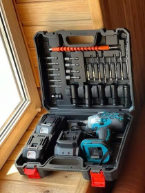 Шуруповерти, электроотвертки Шуруповерты, электроотвертки ^/--/^ Ударний акумуляторний гайковерт з 2 акумуляторами + 25 насадок і кейс ^_^^^ Ударный аккумуляторный гайковерт с 2 аккумуляторами + 25 насадок и кейс - фото фото фото