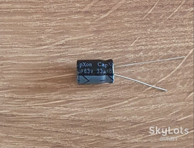 Конденсатори Конденсаторы ^/--/^ 33 /--/ мкФ  63 /--/ В. Capxon 105°C. ^_^^^ 33 /--/ мкФ* 63 /--/ В. Capxon 105°C. - фото фото фото