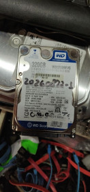 Жорсткі диски Жесткие диски ^/--/^ Жесткий диск для ноутбука 320 Gb / Гб Western Digital Scorpio Blue WD /--/ 3200 /--/ BEVS 2.5 SATA /--/ 2 № 20260827 ^_^^^ Жорсткий диск для ноутбука 320 Gb / Гб Western Digital Scorpio Blue WD /--/ 3200 /--/ BEVS 2.5 SATA /--/ 2 No 20260827 - фото фото фото